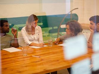 focus group participants round a table